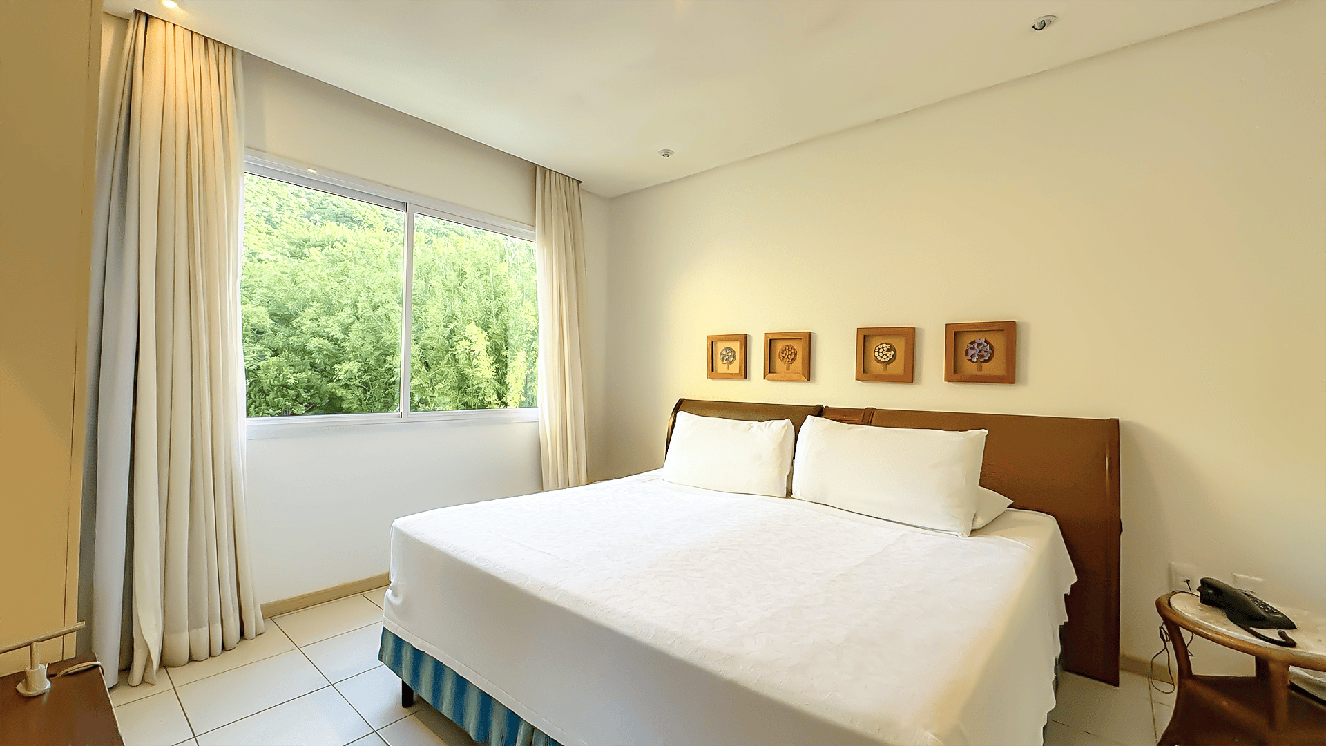 Guest room overlooking greenery at Costão do Santinho Resort